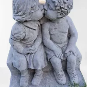boy and girl sitting on step kissing